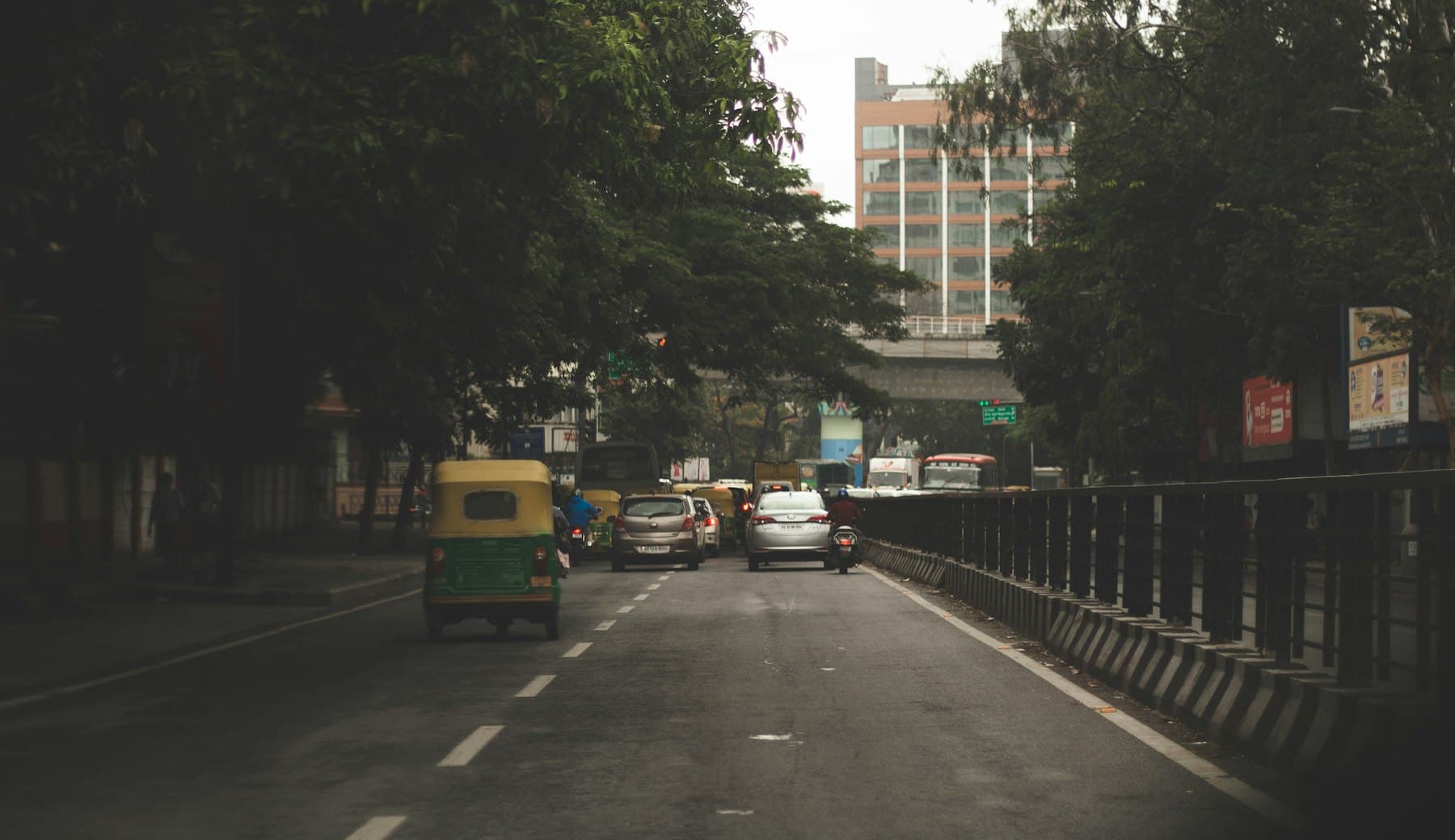 Bengaluru street traffic beside tall buildings, showing the physical city context behind a market where timing and commute corridors still shape job-search strategy.
