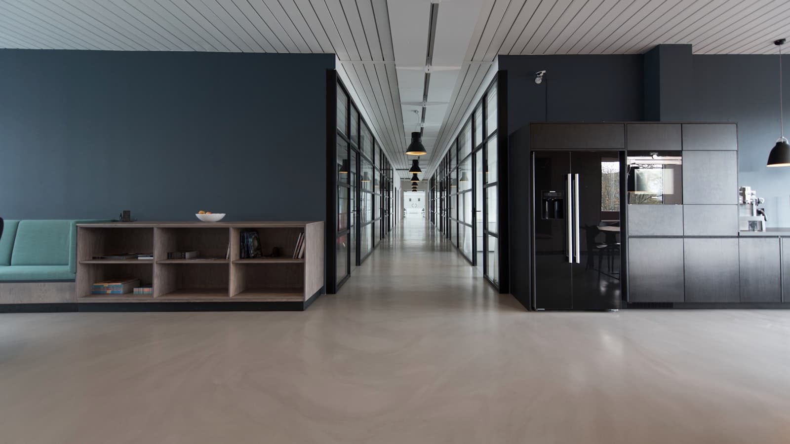 A modern open-plan tech office workspace in Austin, Texas, with collaborative desks and natural light, representing the city's diverse corridor employers from Apple's Domain campus to Tesla's Gigafactory and the Samsung Taylor expansion.