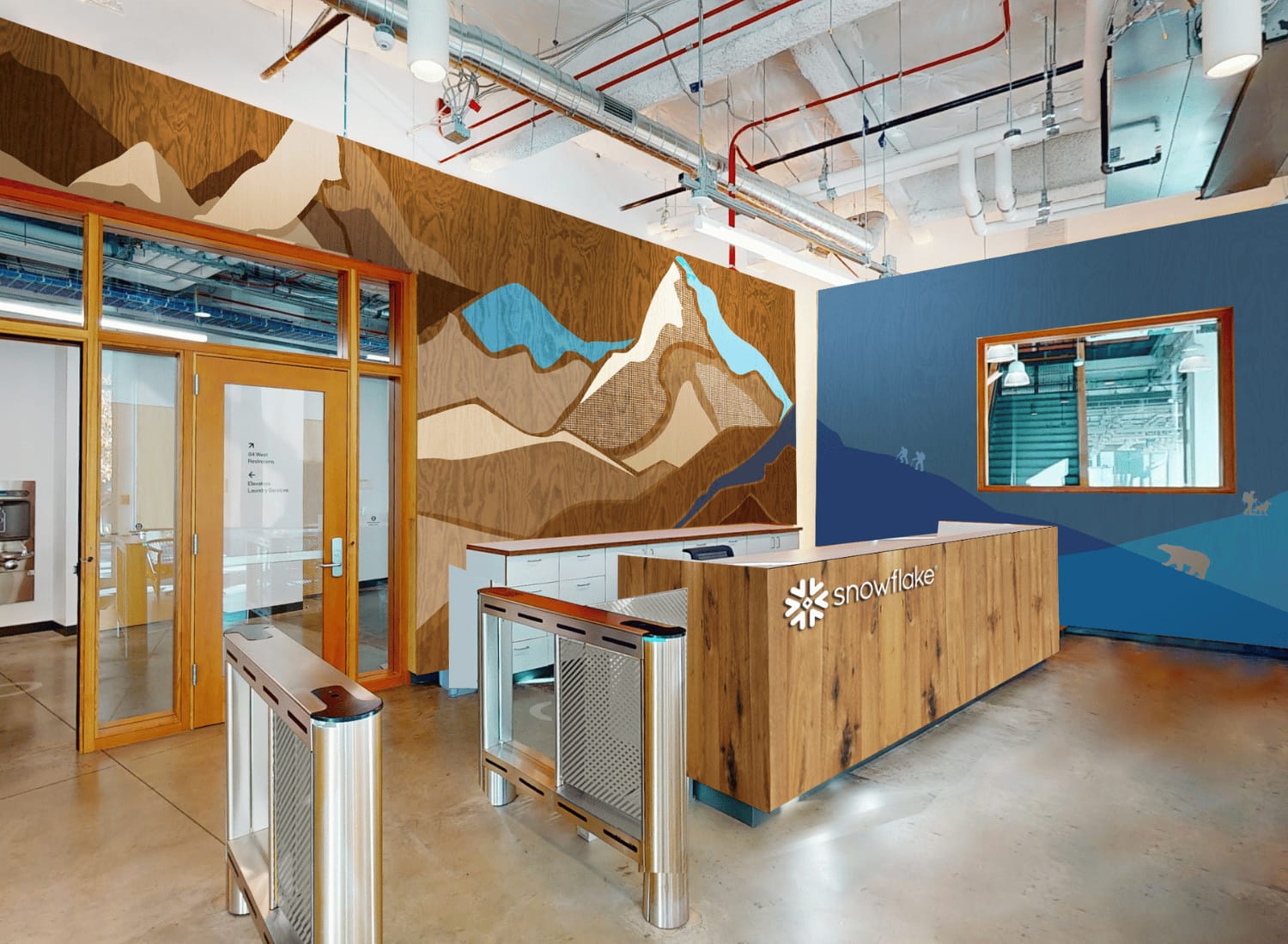 Snowflake Menlo Park office reception with visible Snowflake logo and mountain mural.