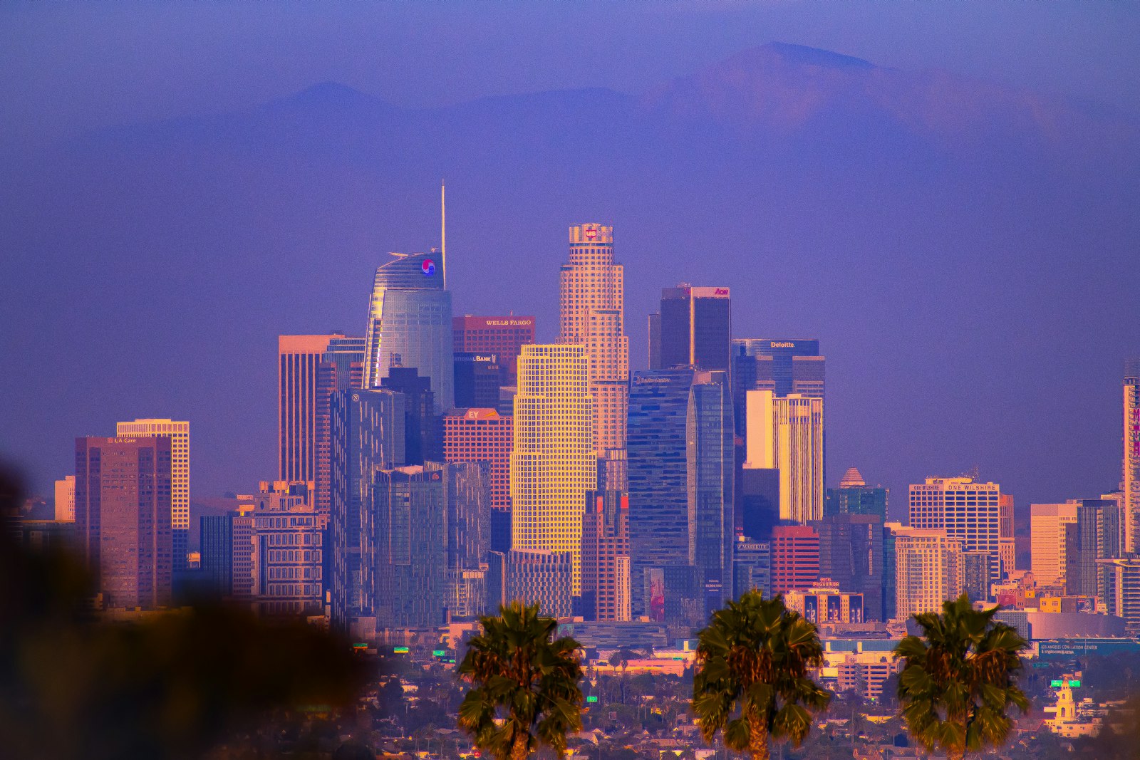 Los Angeles downtown skyline against a colorful sunset sky